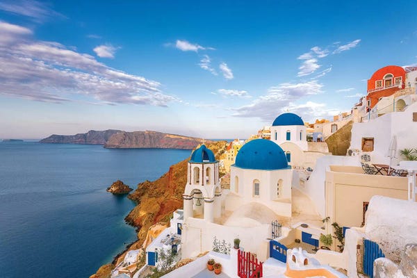 Greece, Oia. Greek Orthodox church and village.