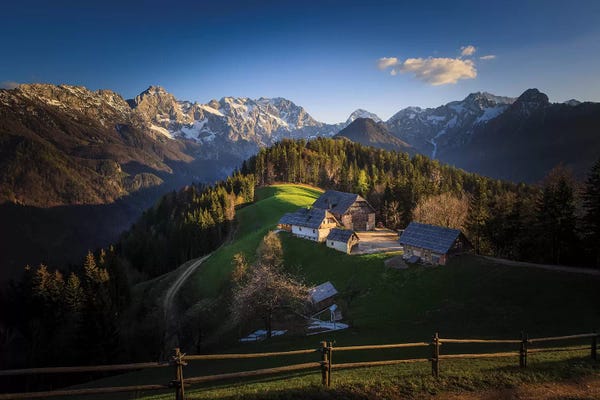 Slovenia, Logarska Dolina. Mountain farm houses at sunset. 