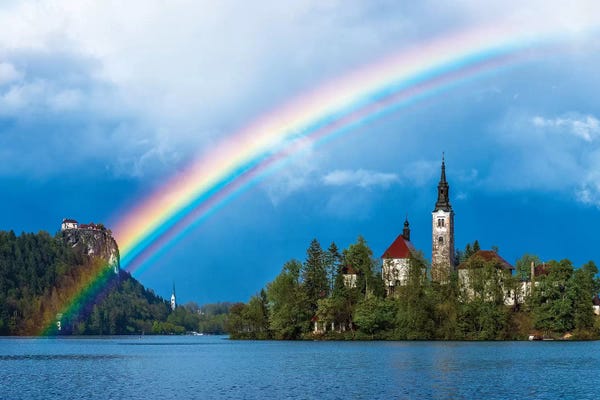 Slovenia. Rainbow over Lake Bled at sunset.