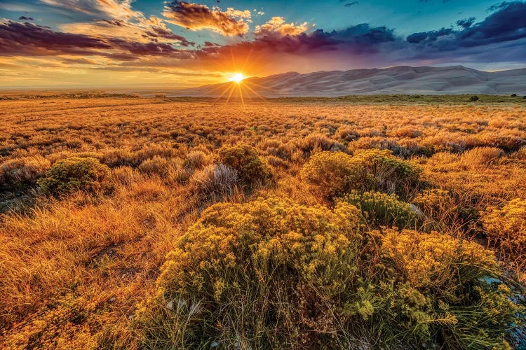 USA, Colorado, Great Sand Dunes National Park and Preserve. Sunset over dunes and plain.