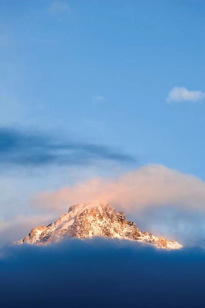 Idaho: USA, Idaho, Sawtooth Range. Sunlit mountain and clouds. by Jaynes Gallery