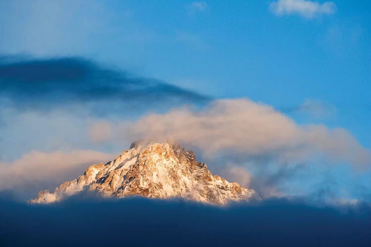 USA, Idaho, Sawtooth Range. Sunlit mountain and clouds.