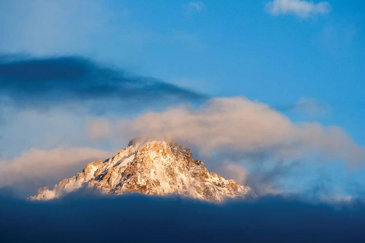 USA, Idaho, Sawtooth Range. Sunlit mountain and clouds.