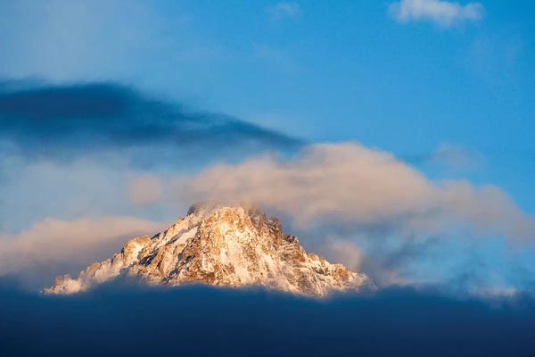 Idaho: USA, Idaho, Sawtooth Range. Sunlit mountain and clouds. by Jaynes Gallery