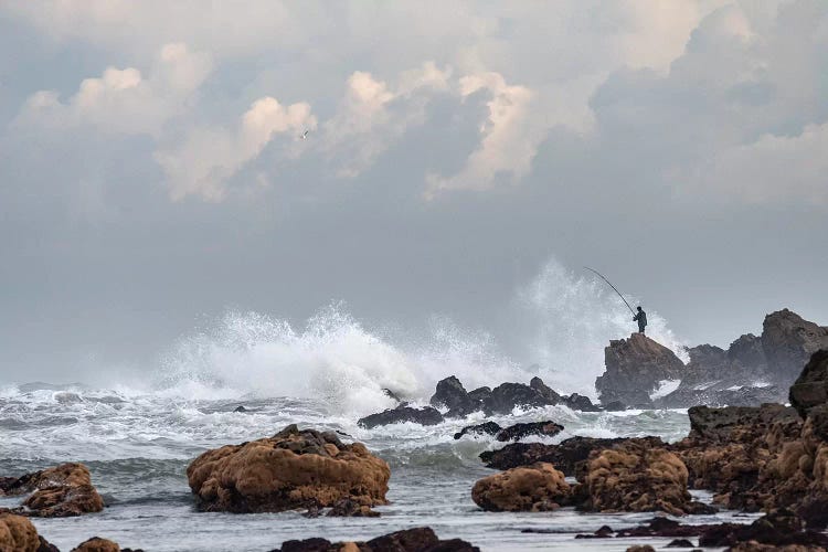 Africa, Morocco, Casablanca. Man Fishing Amid Ocean Waves.