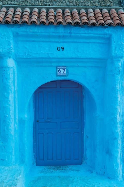 Africa, Morocco, Chefchaouen. Arch Over Wooden Door.