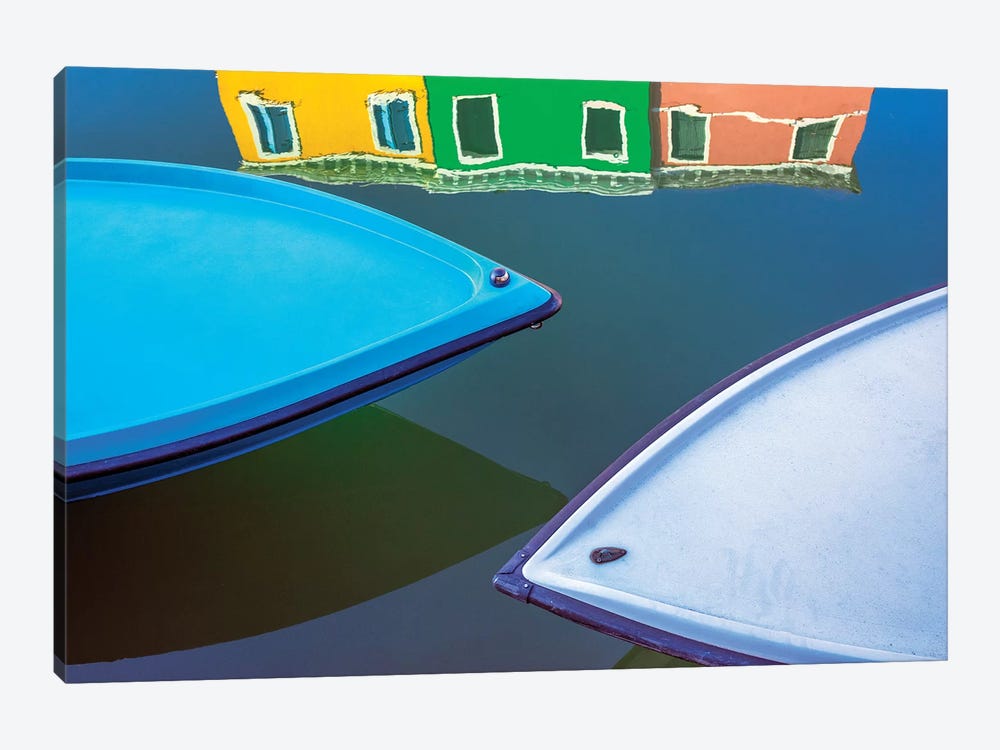 Italy, Burano. Boat Bows And House Reflection In Canal. by Jaynes Gallery 1-piece Canvas Print