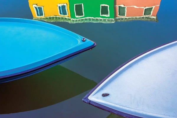 Italy, Burano. Boat Bows And House Reflection In Canal.