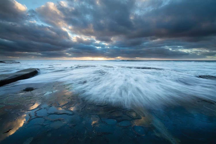 USA, California, La Jolla. Wave washes over tide pools.