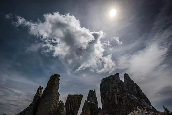 Italy, Dolomites, Cinque Torri. Mountain Peaks And Sun.