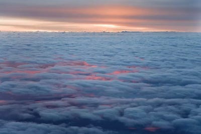 Sunrise From An Airliner Looking Down At Clouds. by Jaynes Gallery canvas print