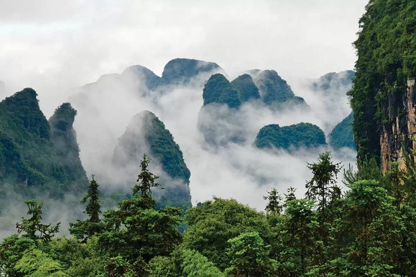 Guangxi: Limestone hills in mist, Yangshuo, Guangxi, China by Keren Su