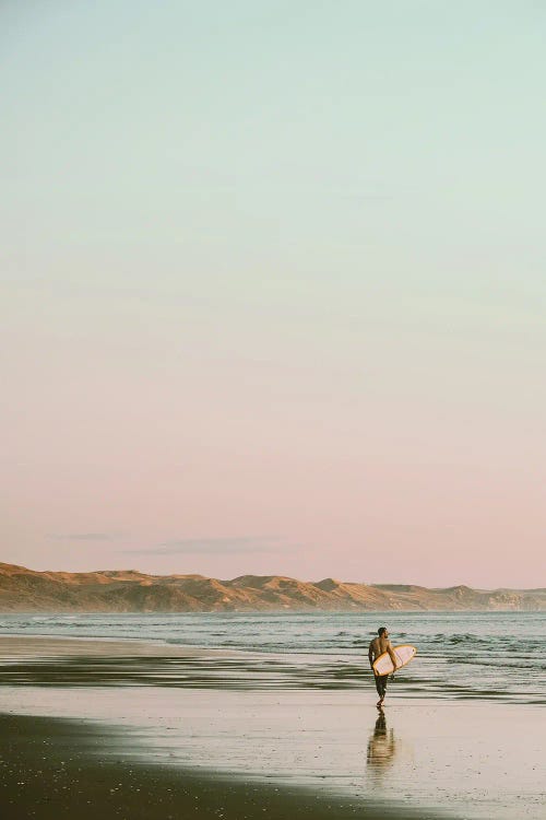 Surfer Walking On The Beach