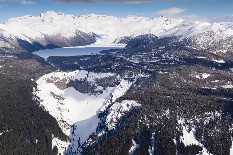 Aerial View Of Frozen Garibaldi Lake And Lava Barrier In The Foreground.