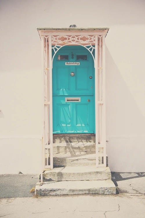 A Mint Green Door And A Pink Building