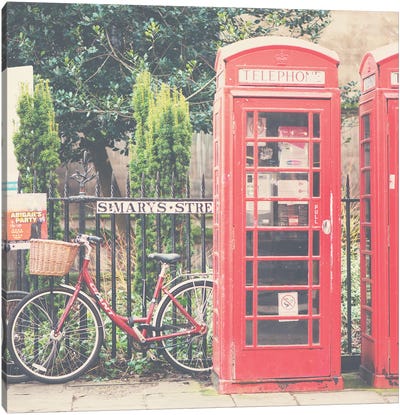 A Red Bicycle And Telephone Boxes Canvas Art Print - Adventure Seeker