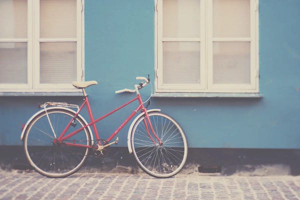 A Pretty Red Bicycle On The Streets Of Copenhagen