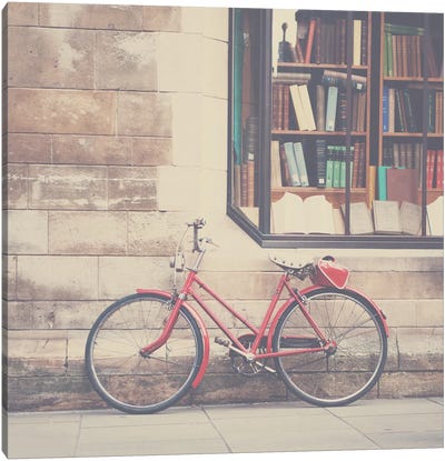 A Vintage Red Bicycle And The Bookstore Canvas Art Print - Laura Evans