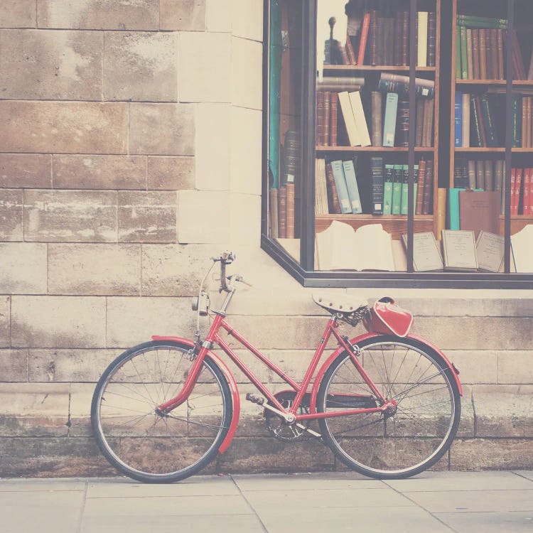 A Vintage Red Bicycle And The Bookstore