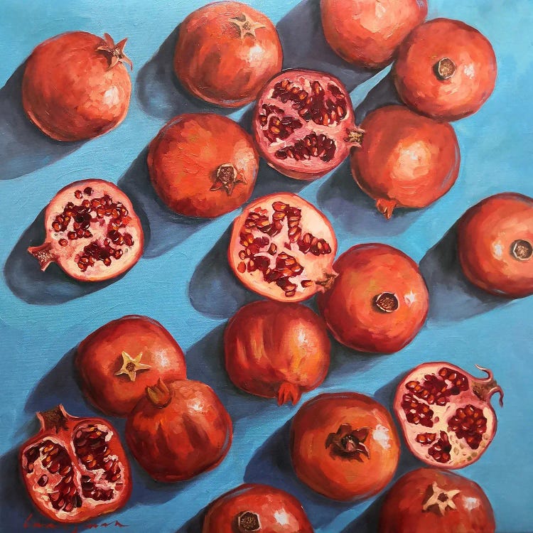 Pomegranates On The Blue Turquoise Background