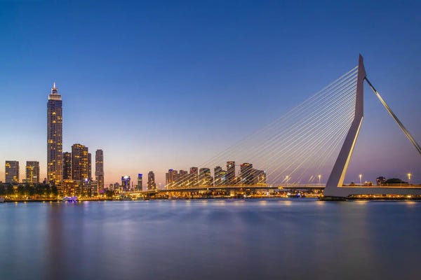 Rotterdam: Erasmus Bridge And Rotterdam Skyline In The Evening by Melanie Viola