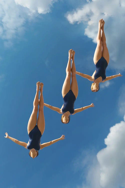 Three Women Jump Into The Water From A Height II