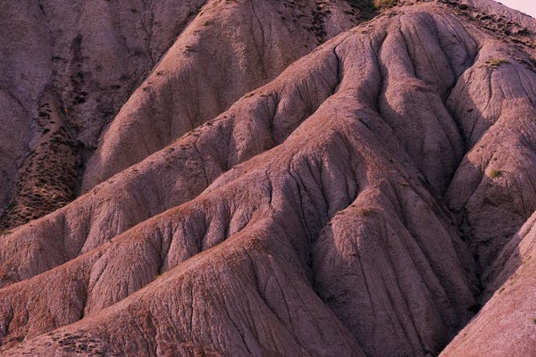 Rocky Mountains: Red Eroded Mountainside by Mike Kiev