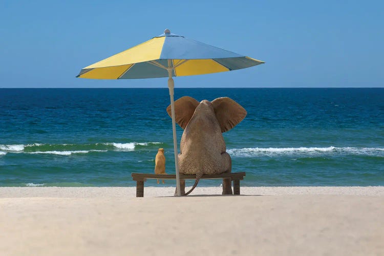 elephant and dog sit under an umbrella on the sea beach