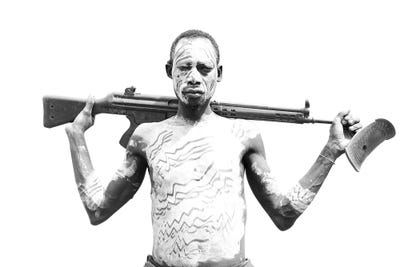 Karo Tribe Gun by Mark MacLaren Johnson canvas print