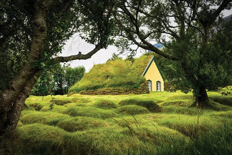 Iceland, Turf-Roofed Hof Church And Surrounding Grave Mounds.