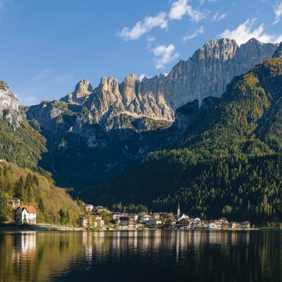 Alleghe at Lago di Alleghe under the peak of Civetta, an icon of the dolomites in the Veneto, Italy by Martin Zwick art print