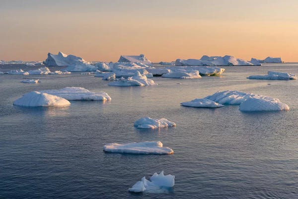 Icebergs in the Disko Bay. Inuit village Oqaatsut located in Greenland