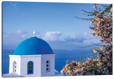 Blue domed Greek Orthodox church with bougainvillea flowers in Oia, Santorini, Greece. Canvas Art Print - Dome Art
