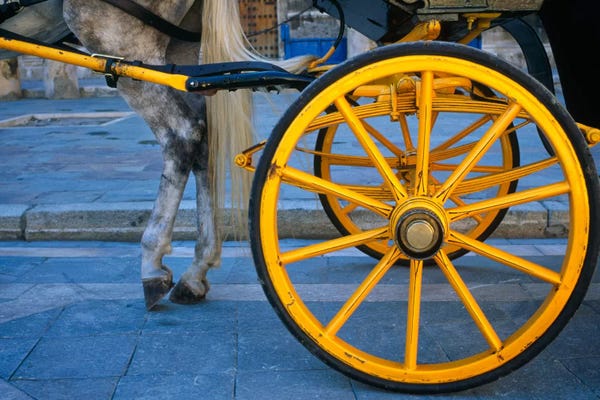 Andalusia: The Yellow Wheel, Seville, Spain by Jim Nilsen