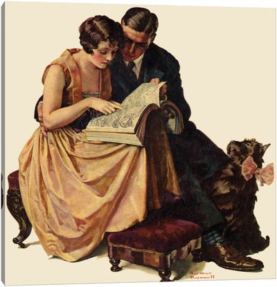 Young Couple Looking at Catalogue Canvas Art Print - Reading