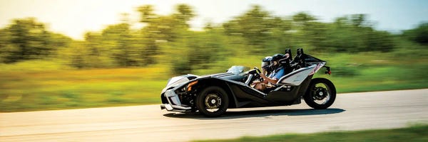 Nik Rave: Polaris Slingshot On The Track In Motion Color Black by Nik Rave