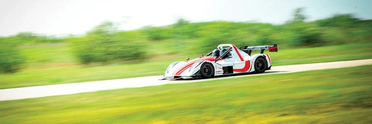 White & Red Formula 1 On The Track In Motion