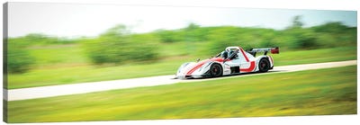 White & Red Formula 1 On The Track In Motion Canvas Art Print