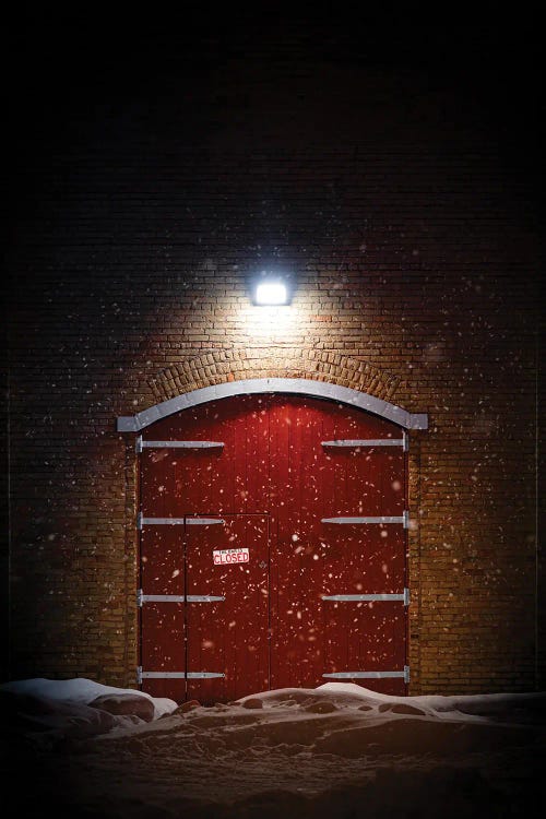 Big Red Barn Door At Night In A Spotlight During The Winter