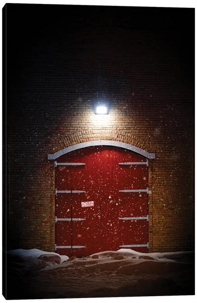 Big Red Barn Door At Night In A Spotlight During The Winter Canvas Art Print - Nik Rave