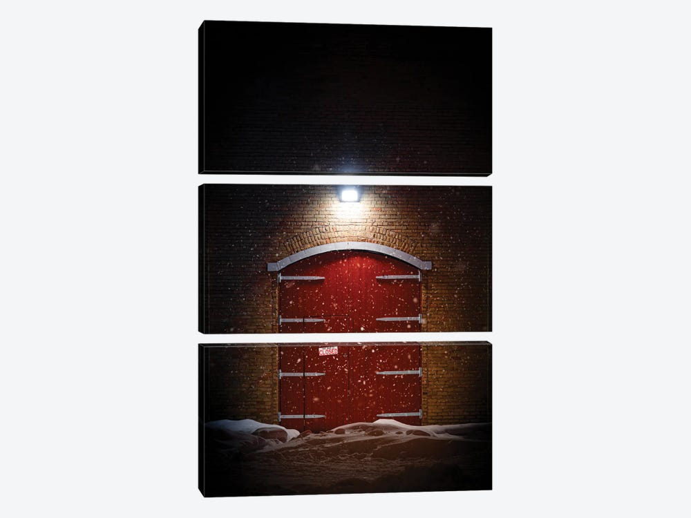 Big Red Barn Door At Night In A Spotlight During The Winter by Nik Rave 3-piece Art Print