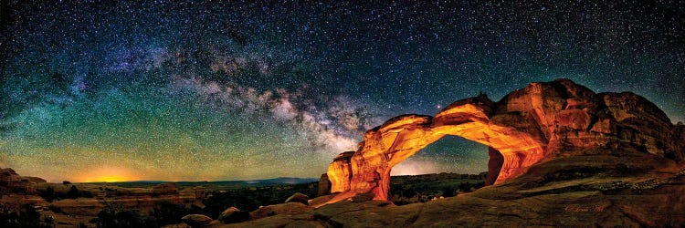 A Glowing Milky Way Rises Over Broken Arch In Arches National Park, Utah