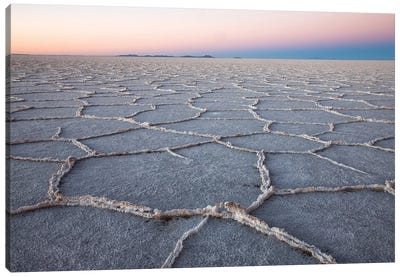 The largest salt flats in the world located in Uyuni, bolivia as the sun is rising in winter. Canvas Art Print