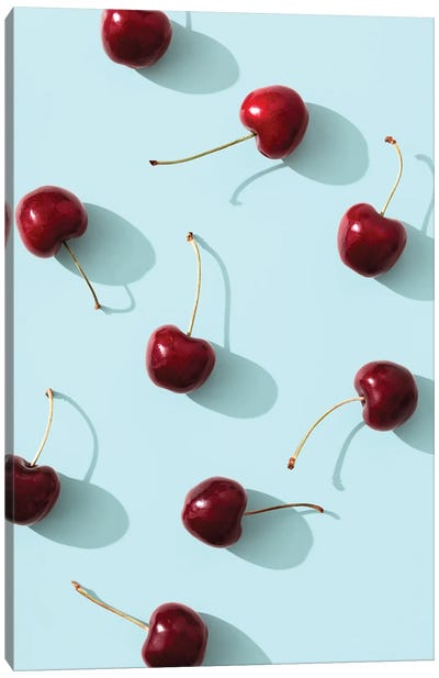 Cherries on turquoise background Canvas Art Print