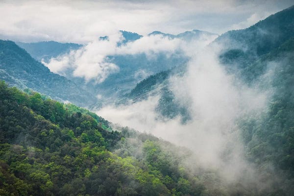 The Himalayas: Clouds Rolling Through The Himalayas by Mark Paulda