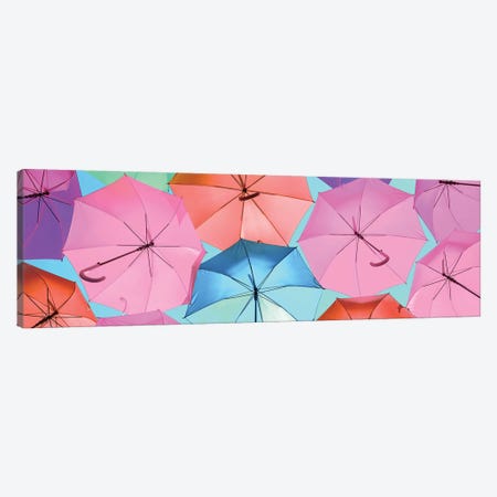 Colourful Umbrellas  - Light Blue Sky Canvas Print #PHD533} by Philippe Hugonnard Canvas Wall Art