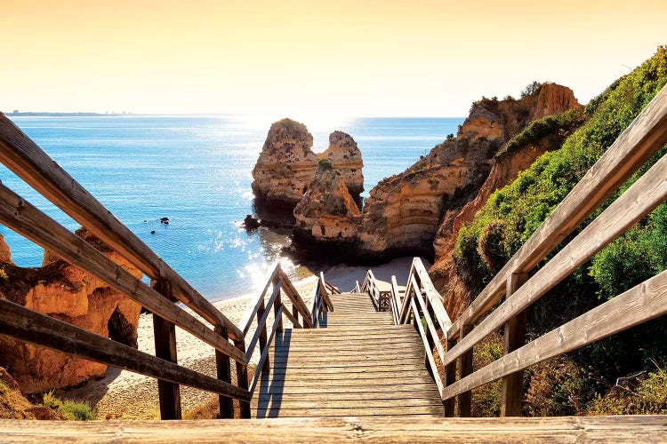 Wooden Stairs to Praia do Camilo Beach at Sunset