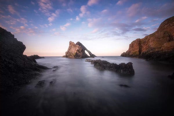 Rocky Beaches: Bow Fiddle Rock In Scotland Sea by Philippe Manguin