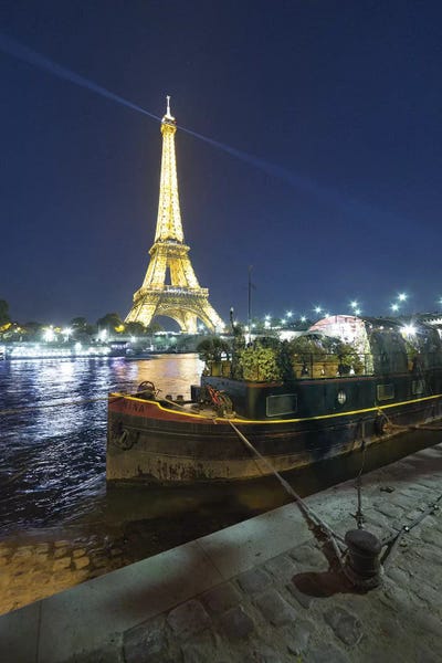 Towers: Eiffel Tower In Paris And Seine Chanel By Night by Philippe Manguin