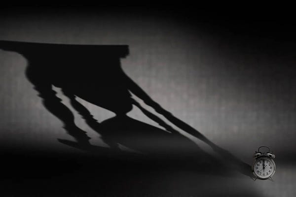 Clocks: Clock with hourglass shadow by Panoramic Images